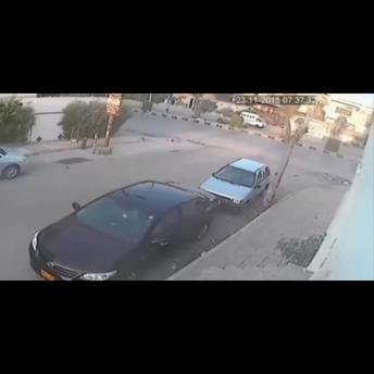 Stupid thief caught while trying to break in a car!!