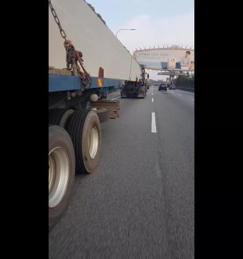 Sketchy Motorcycle Maneuver Under Semi Truck
