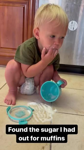 Mom finds quiet toddler eating sugar on kitchen floor 